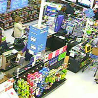 <p>The two suspects at the counter of the Walmart in Norwalk.</p>