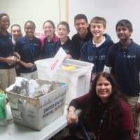 <p>Students from Side-By-Side Charter School came to Person-To-Person&#x27;s Norwalk food pantry to organize donated food Monday.</p>