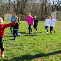 <p>Students finish the Turkey Trot with smiles and happiness.</p>