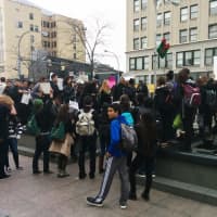<p>White Plains High School students hold up peace signs during their protest at Renaissance Plaza </p>