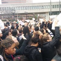 <p>White Plains High School students hold up peace signs during their protest at Renaissance Plaza.</p>