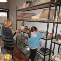 <p>Store owner Vonnie Sullivan gives visitors a tour during her grand opening on Tuesday.</p>