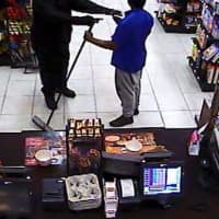 <p>The second suspect, seen with a gun.</p>