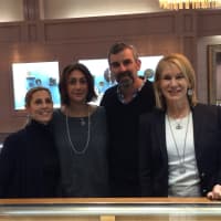 <p>Some of the Landserg jewelers staff pose with Jeffrey and Susan Landsberg, far right.</p>