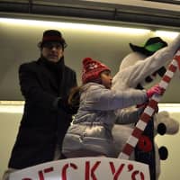 <p>Frosty officially turning on the switch to light Wampus Brook Park&#x27;s Christmas tree.</p>