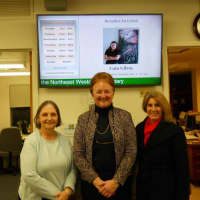 <p>Susan Petroccione, Pat Miller and Rose Corbett show off the library&#x27;s new display screen.</p>