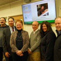 <p>Doug Abdelnour, Anthony Cirieco, Pat Miller, Dick Atkins, Ann Westerman and Jim Hasl stand beneath the new screen.</p>