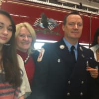 <p>Newly promoted Wilton Fire Department Lt. Jeffery Locher with, from left daughter Jacqueline, sister Melinda Locher McCreary and his wife Tracy. He was sworn in on Monday.</p>
