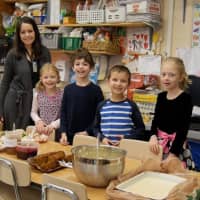<p>Carrie E. Tompkins Elementary School first-graders share a Thanksgiving feast together.</p>