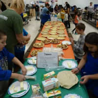 <p>Students added toppings and fillings into the pies.</p>