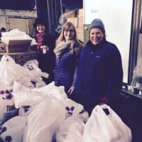 <p>Volunteers with the Junior League of Bronxville delivering food to families in need last year. They will bring a Kraft Mobile Food Pantry to Mount Vernon on Saturday at the Parker Elementary School.</p>