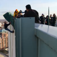 <p>Fox 5 Sports anchor Duke Castiglione hangs over the edge of Stamford&#x27;s Landmark Square building, 22 stories above the street, during Friday&#x27;s rehearsal for Heights &amp; Lights.</p>
