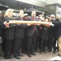 <p>First Selectman Peter Tesei cuts a giant loaf of bread to mark the grand re-opening of the Balducci&#x27;s in Greenwich on Friday.</p>