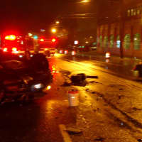 <p>A SUV hit a compact car outside the Norwalk Fire Department headquarters Friday night, knocking the SUV onto its roof.</p>
