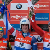 <p>Tucker West (center) of Ridgefield celebrates after his World Cup win last week in Lake Placid, N.Y.</p>