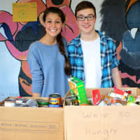 <p>North Salem students collect food items to be donated to the local Lions Club during a badminton tournament.</p>