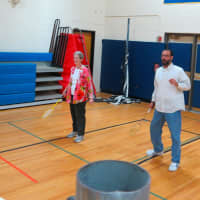 <p>Faculty play a game of badminton. </p>