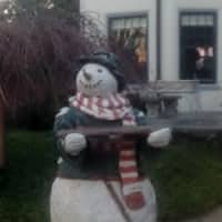 <p>A classic folklore-style snowman decorates a home in low-key style on Deer Hill Avenue in Danbury. </p>