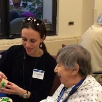 <p>Elizabeth Trump of New Rochelle does crafts with a Kittay House resident.</p>