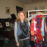 <p>Susan Obrant, in front of her clothes at her gallery in Peekskill. </p>