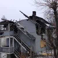 <p>The structure on West Wooster Street, located behind another house, sustained extensive damage in the fire. </p>