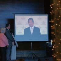 <p>Friends, staff and supporters listen to a video message from Earl Lee, CEO of HSF Affiliates, LLC, welcoming Cynthia and Joe Lippolis and their real estate firm as the first Berkshire Hathaway Affiliate in Westchester County. </p>