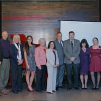 <p>County officials pose for a photo, along with executives from Berkshire Hathaway HomeServices River Towns Real Estate. </p>
