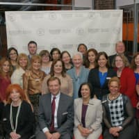 <p>Joe and Cynthia Lippolis, Berkshire Hathaway HomeServices River Towns Real Estate, seated center, pose with their talented team of real estate agents during the launch party to celebrate their new affiliation with Berkshire Hathaway HomeServices.</p>