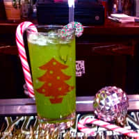 <p>River Roadhouse&#x27; The Grinch, Midori melon liqueur, pineapple juice and coconut vodka served over ice in a highball glass.</p>