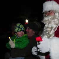 <p>A child is thrilled to see Santa. </p>