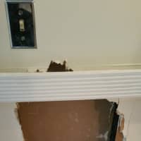 <p>Fairfield Police said the burglar was able to gain entrance to the spa through this hole in the wall.</p>