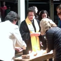 <p>The Rev. Roberta Finkelstein leads a candle-lighting service in memory of those lost in the Sandy Hook School shooting on Dec. 14, 2012. The event was held at the Westport Unitarian Church.</p>