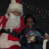 <p>Santa Claus and a young boy at the Ossining Community Center.</p>