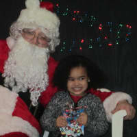 <p>Santa Claus and a young girl at the Ossining Community Center. </p>