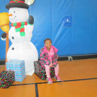 <p>Africo Lewis with Frosty the Snowman.</p>