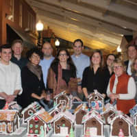 <p>Volunteers from UBS helped make gingerbread houses at Waveny LifeCare Network in New Canaan. See story for IDs.</p>