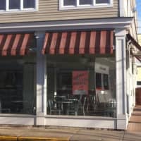 <p>Crumbs in Westport invites customers back with a &#x27;Say Hello Again&#x27; sign in the window. </p>