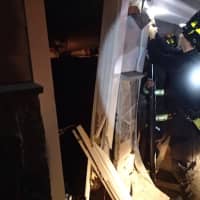 <p>Westport firefighters on the scene of a van that crashed into a garage.</p>