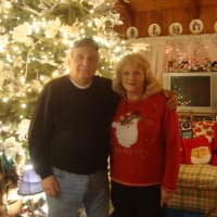 <p>Rick and Joan Setti in their living room, which is just as adorned with Christmas decorations as their front lawn.</p>