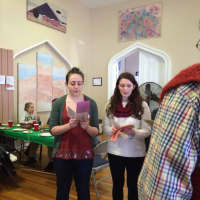 <p>Volunteer Emily Code and others singing songs at the Christmas dinner last year.</p>