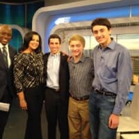 <p>The students pose with the news anchors of WPIX-TV NY.</p>