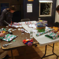 <p>Nick Murphy, Kerry Blatney and Laura Schwartzman wrap gifts during the Depot&#x27;s annual Wrap Up event.</p>