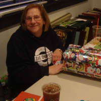 <p>Janice Marzano helps wrap gifts Monday at the Depot.</p>