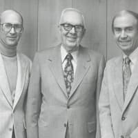<p>Bill Mitchell, left, stands with his father, Ed, center, and brother Jack. Ed Mitchell, who founded the business with his wife, Norma, in 1958.</p>