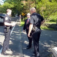 <p>Westport police officers talk with a secret service agent outside the Westport home of movie producer Harvey Weinstein Monday afternoon before President Barack Obama&#x27;s arrival.</p>