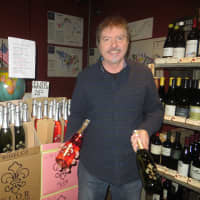 <p>A salesman displays Tarry Wine&#x27;s Flor Rose and non-rose Prosecco.</p>