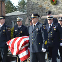 <p>Mount Kisco police and firefighters serve as pall bearers at George Griffin&#x27;s funeral.</p>