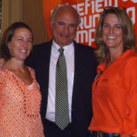 <p>Ridgefield&#x27;s Megan Searfoss, right, stands with business partner Deb Povinelli, left, and First Selectman Rudy Marconi at the grand opening of Ridgefield Running Company in October.</p>