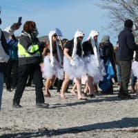 <p>Costumed participants get ready to the New Year&#x27;s Polar Plunge on Thursday morning at Compo Beach in Westport. </p>