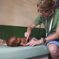 <p>Dr. Katherine Hough, pediatrician at Pediatrics on Hudson, in Hastings-On-Hudson examines a baby. </p>